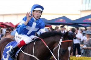 Hugh Bowmanl above, rides Relucent in the 2019 Victoria Derby at Flemington. Photo by Daniel Costello.